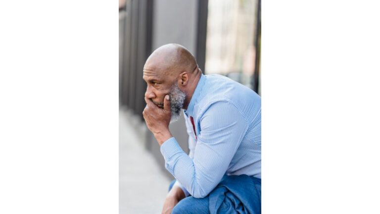 Worried black employee on Street after dismissal