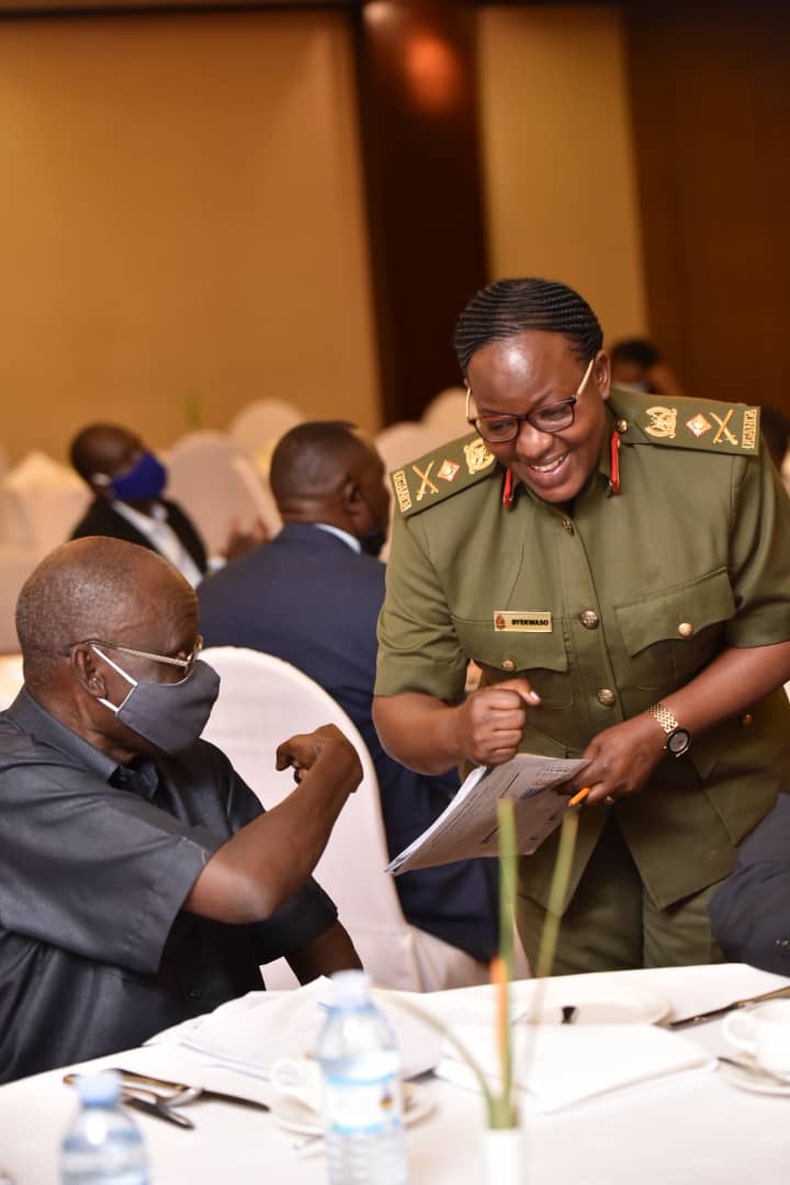 Prof Fredrick Jjuko greets UPDF Spokesperson, Brig. Flavia Byekwaso/ Photo: Uganda Editors' Guild