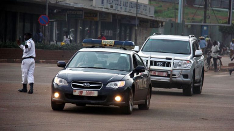 A Police lead car escorting a Ugandan Government Official's motorcade/convoy