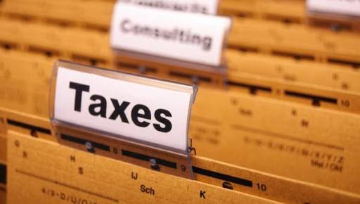 Poster with word "Taxes"