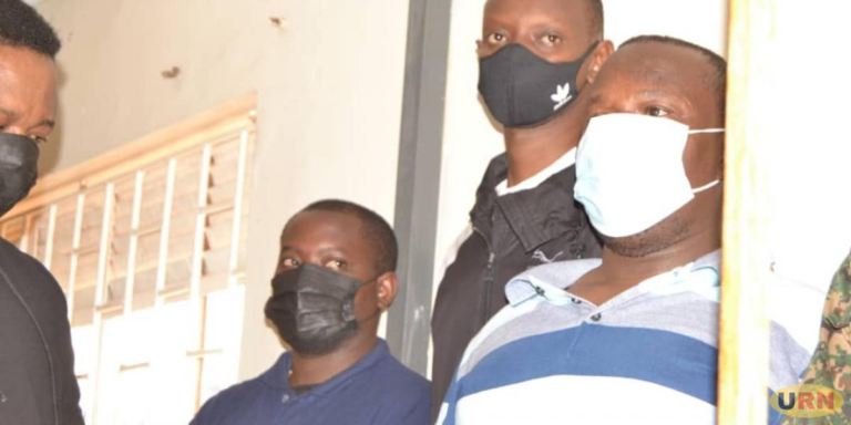 Dennis Buchanan ( Middle with Mask) and his Co-accused in the Court Martial last year. / Photo: URN