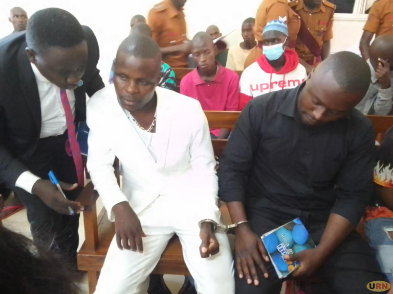 Sipapa listens to his lawyer in Court
