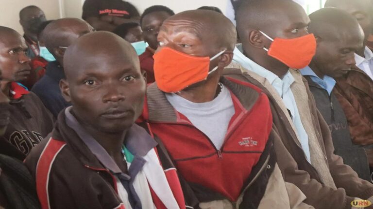 Vianney Armstrong Ahimbisimbwe (without a face mask) before Court on Wednesday)