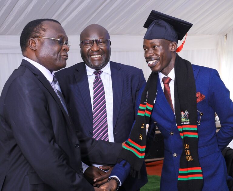 Chief Justice Owiny Dollo shakes hands with Iya Israel as Makerere Law School Principal Prof. Ronald Naluwairo looks on.